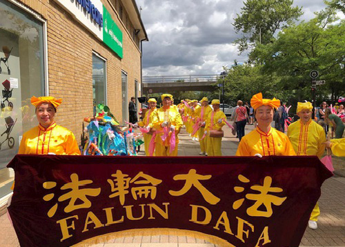 Image for article Inggris: Praktisi Falun Gong Berpartisipasi dalam Parade Karnaval Chelmsford